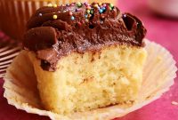 Classic Vanilla Cupcakes Topped with Decadent Chocolate Frosting