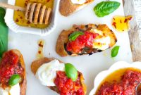 Tomato Confit and Burrata Crostini with Basil and Olive Oil