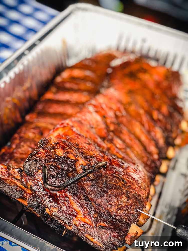 How to Tell When Pork Ribs Are Perfectly Cooked 5 slide a temperature probe between the bones to test if ribs are done