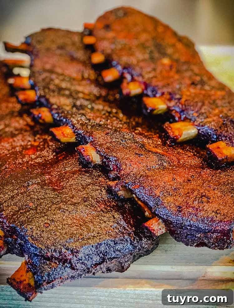 How to Tell When Pork Ribs Are Perfectly Cooked 6 three slabs of pork ribs ready to serve
