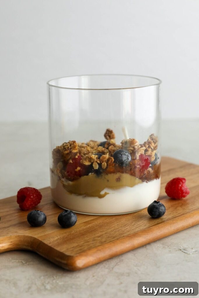 first layers of SunButter Berry Spring Parfait in glass jar
