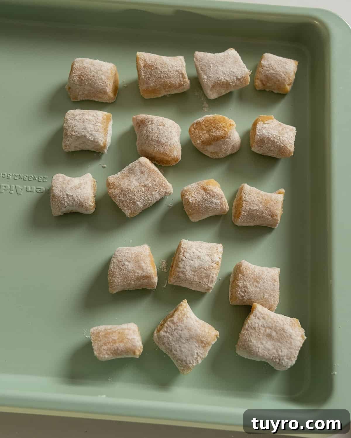 Gnocchi separated out on a baking tray. 