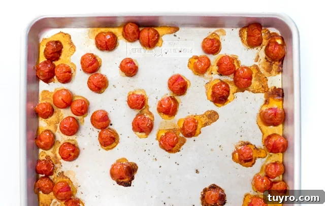 Creamy Walnut Pesto Pasta Recipe for Quick Weeknight Meals 7 Cherry tomatoes on a baking sheet.