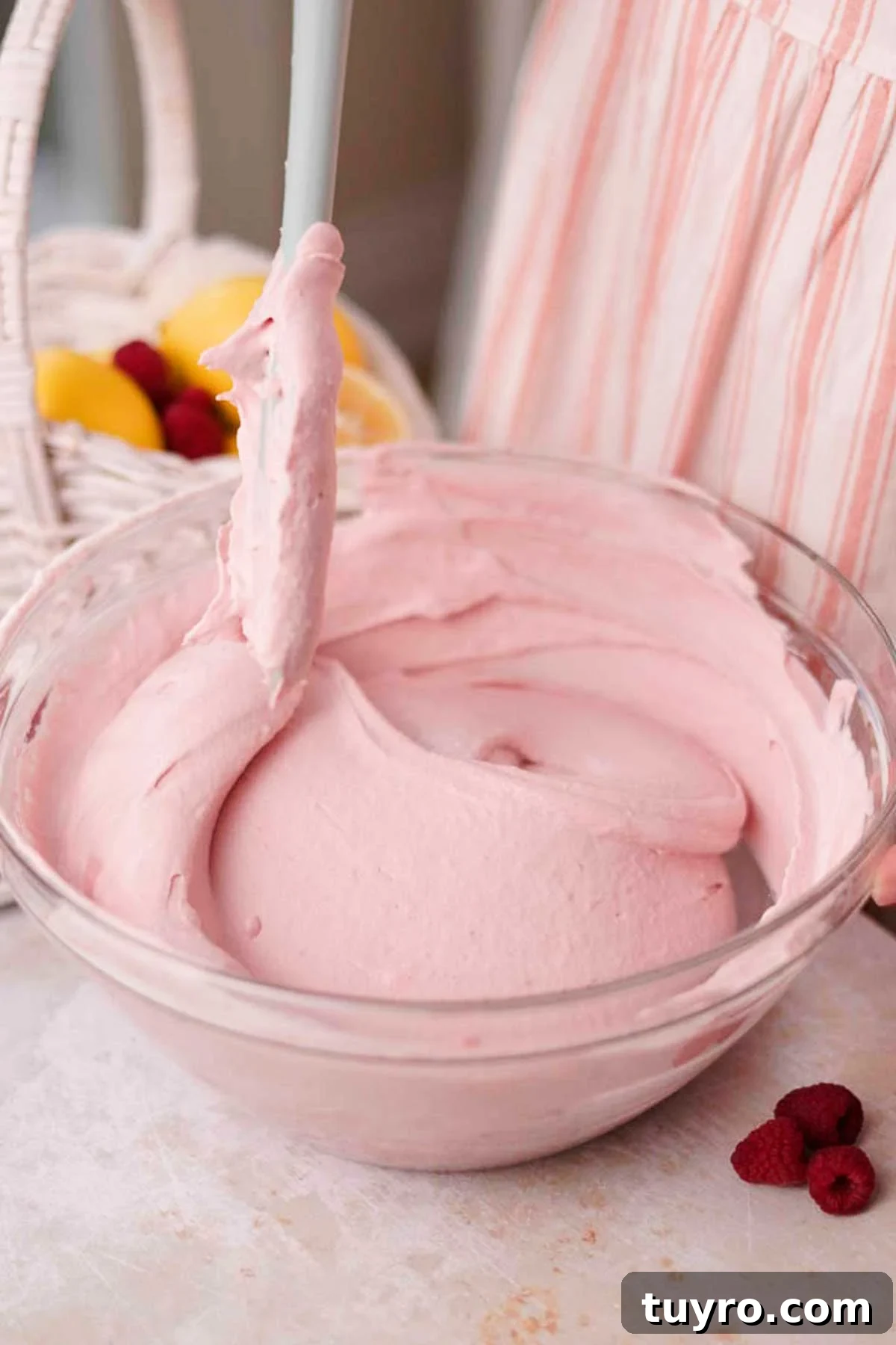 Raspberry Tiramisu Recipe: Light, Creamy Berry Dessert 11 fold whipped cream into raspberry tiramisu filling with a spatula