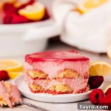 Raspberry Tiramisu Recipe: Light, Creamy Berry Dessert 21 raspberry curd tiramisu slice on small plate with fresh raspberries