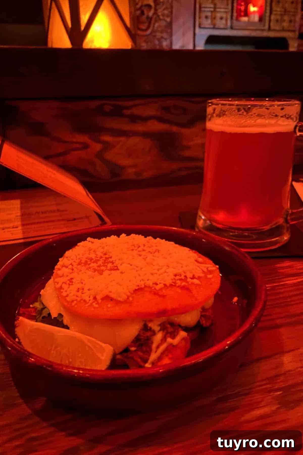 Beak & Barrel Restaurant Review: Dining Tips for Magic Kingdom 11 the beak and barrel griddled corn cake with chicken and pint of beer