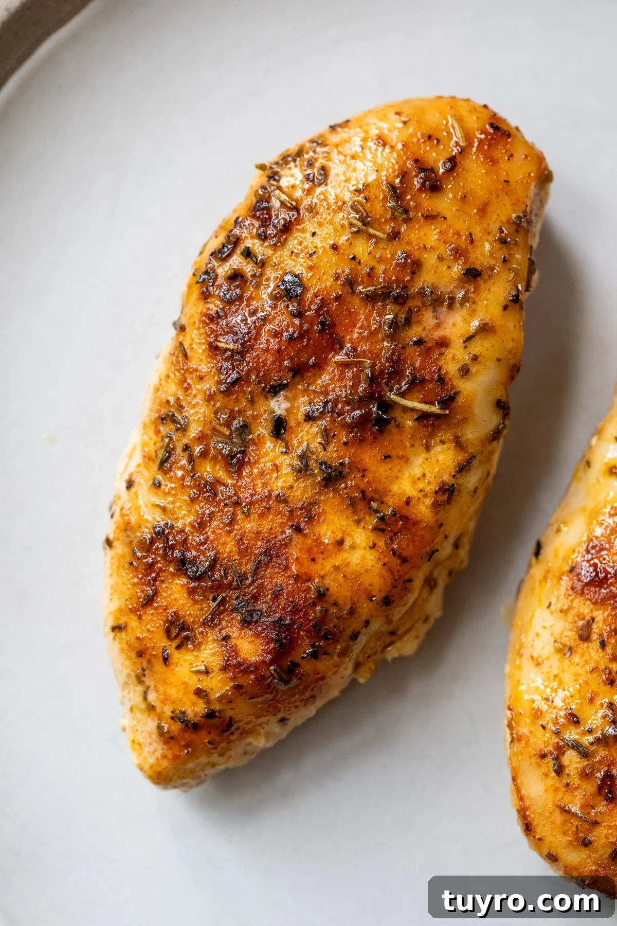 Tender Slow-Cooker Chicken Breast Recipe for Quick Meals 7 close up on a slow cooked chicken breast.