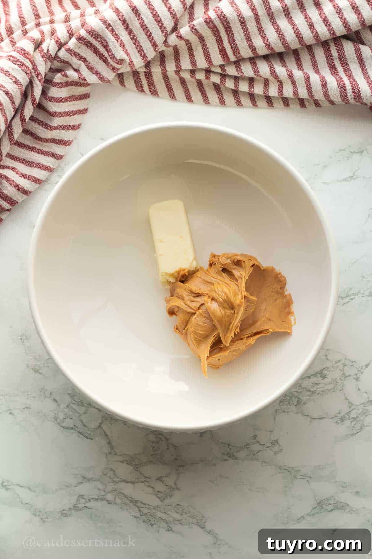 No-Bake Peanut Butter Rice Krispie Balls 4 Butter and peanut butter in bowl.