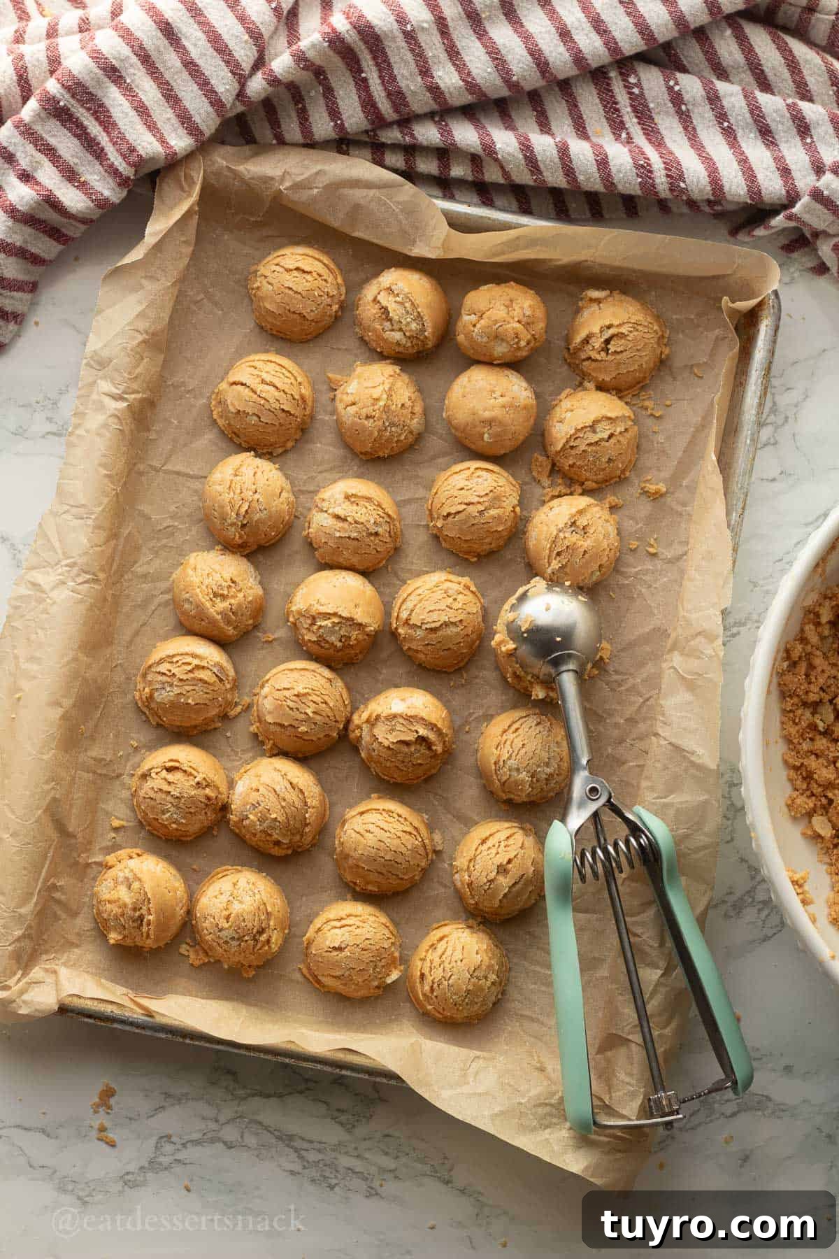 No-Bake Peanut Butter Rice Krispie Balls 7 Scooped peanut butter balls on tray.