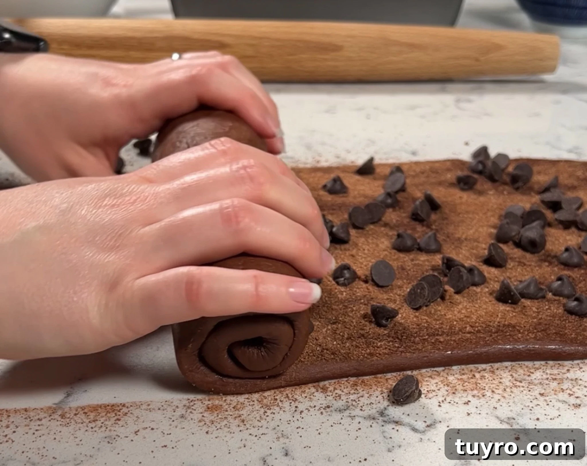Chocolate Swirl Bread Recipe — Soft Homemade Choco Loaf 20 Rolling up the dough into a log.