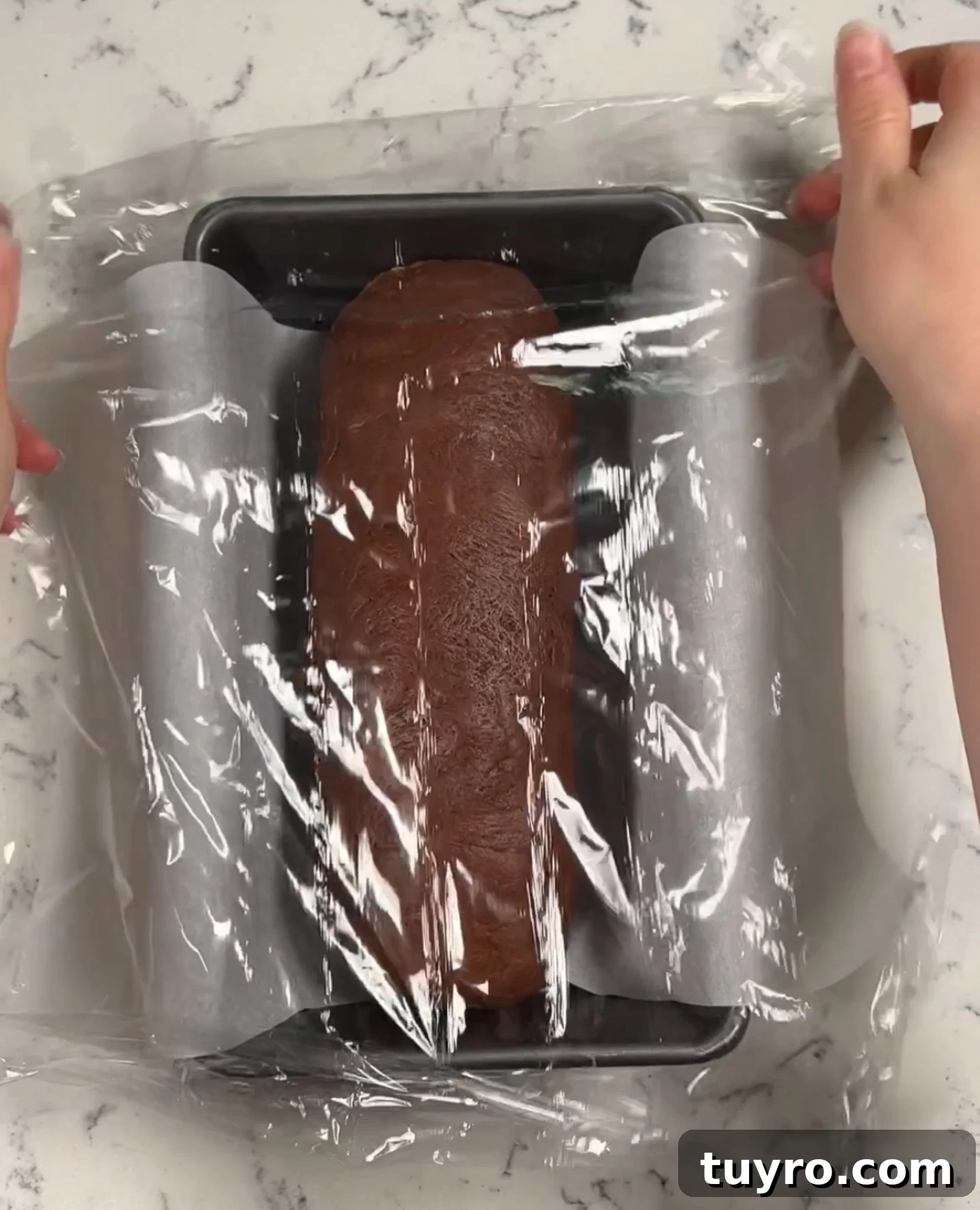 Chocolate Swirl Bread Recipe — Soft Homemade Choco Loaf 21 Covering the rolled up log in the loaf pan with cling film.