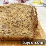 Sliced no sugar added banana bread on a wooden board.