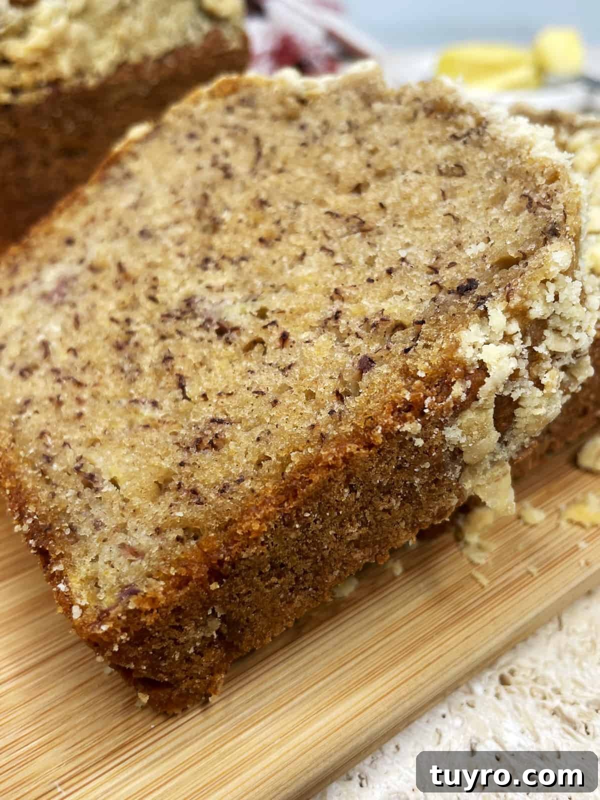 Sugar-Free Banana Bread Made with Natural Ingredients 3 Thickly sliced banana bread topped with streusel: Close up