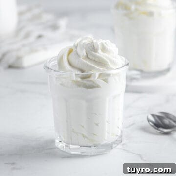 Sugar free whipped cream piped in glasses.