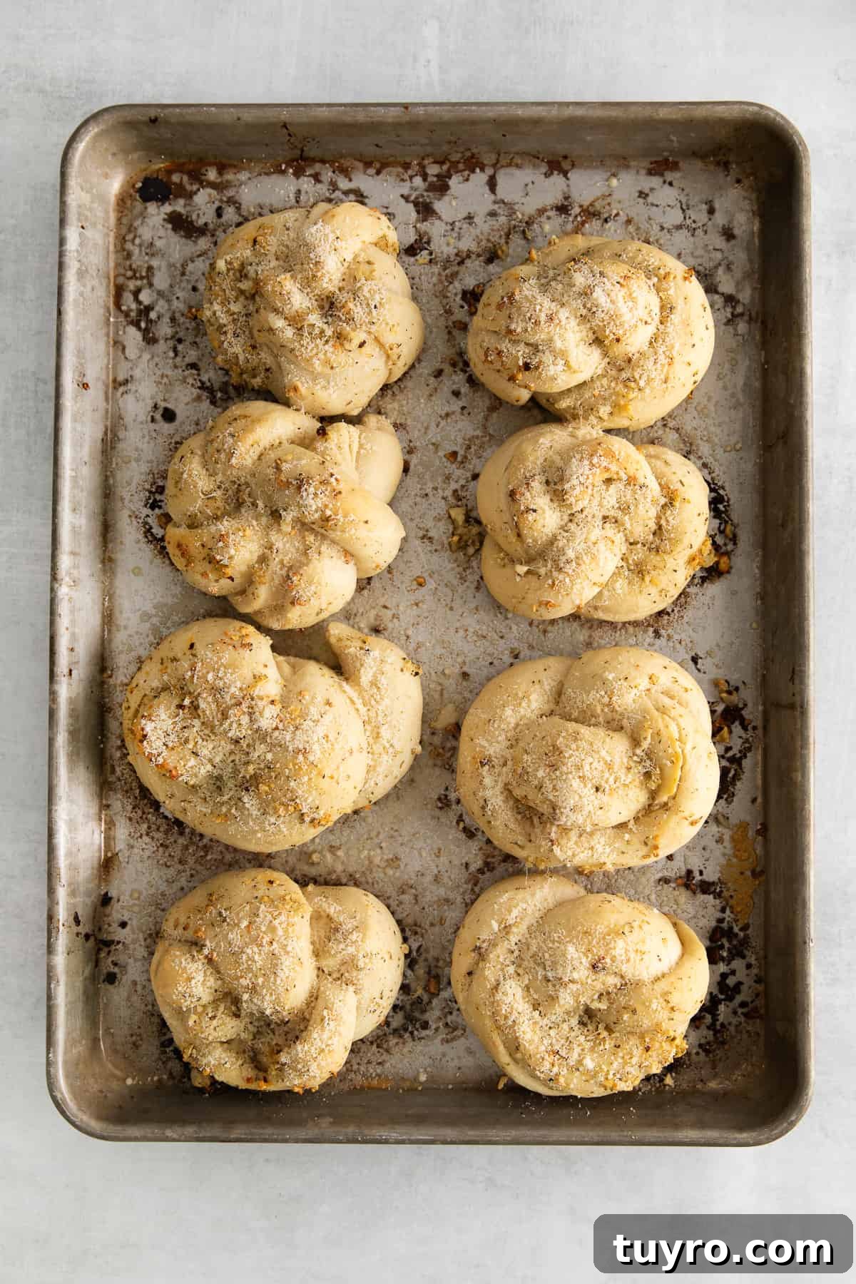 Homemade Parmesan Garlic Knots Recipe 7 Baked knots with butter brushed over the top.