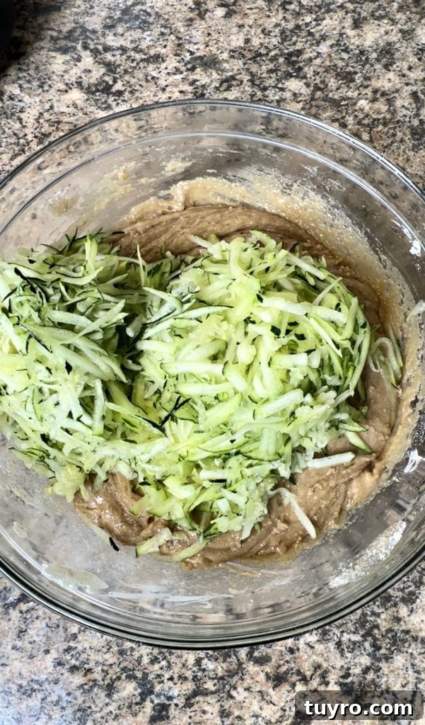 Moist Zucchini Bread Recipe with Cinnamon Streusel 6 Adding zucchini to batter