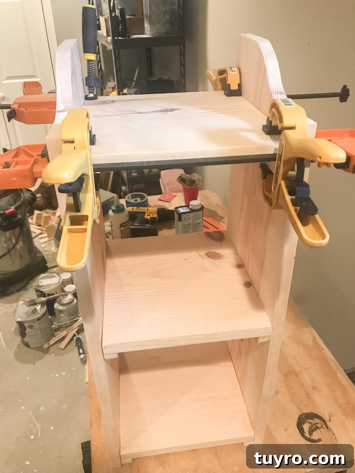 Versatile Bookshelf End Table with Storage and Display Space 8 clamping down shelf to bookshelf