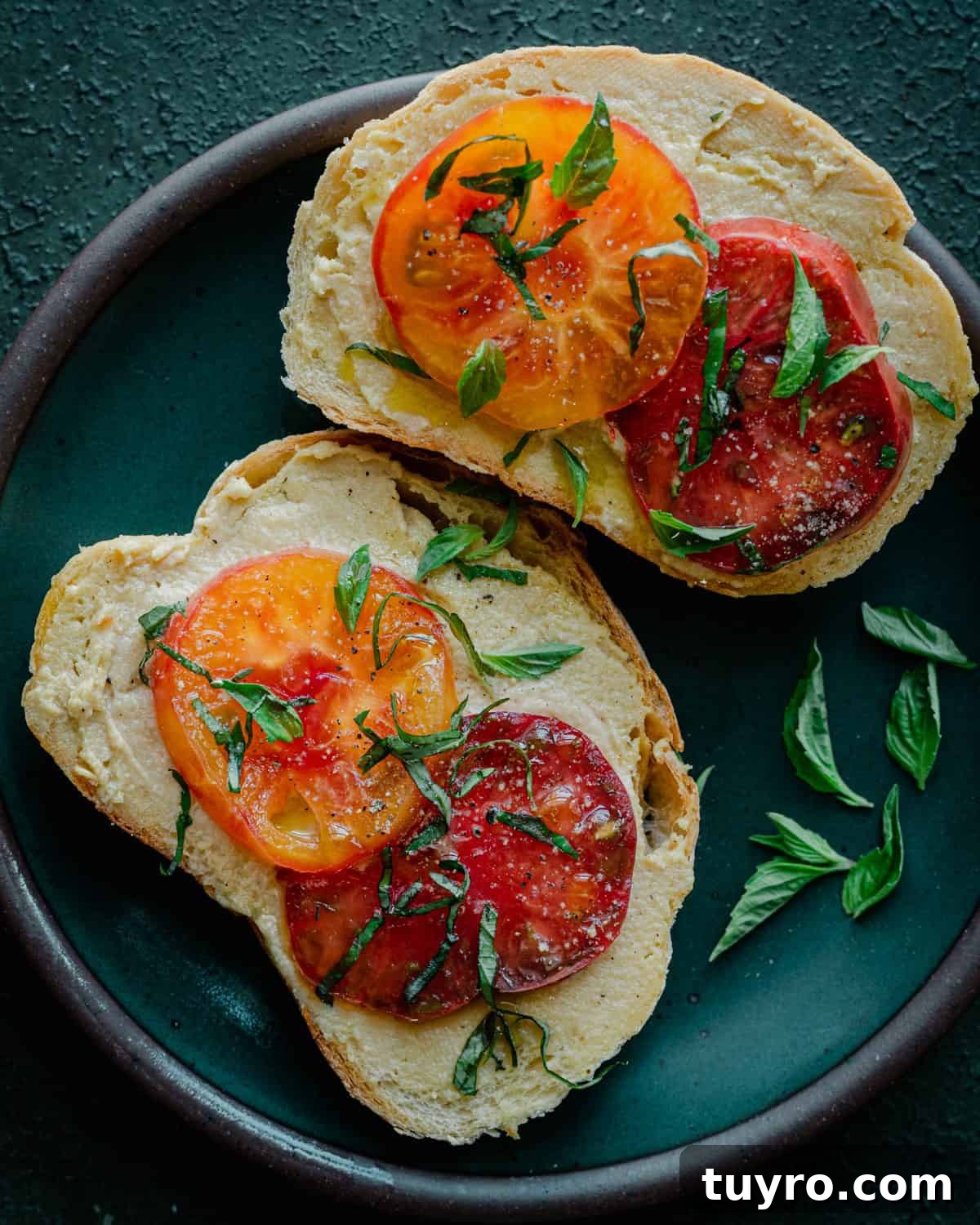 fermented cashew cheese on toast with heirloom tomatoes and basil