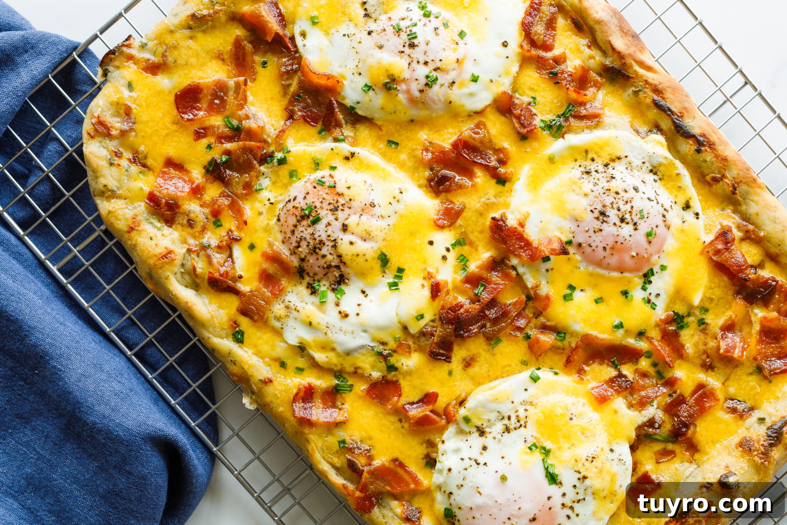 The finished Easy Bacon and Egg Pizza on a cooling rack