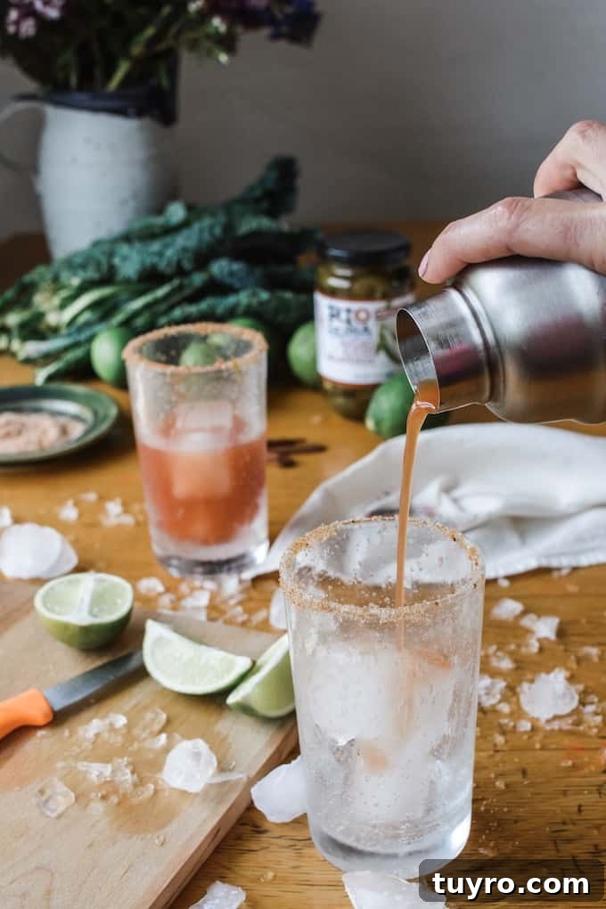 Spicy Jalapeno Michelada Recipe 2 #ad|This is the best authentic Michelada beer cocktail you will ever try, flavored with fiery pickling liquid from the peppers and a whole pile of jalapeños and lime. #michelada #jalapenos #beercocktail #beer #spicycocktail