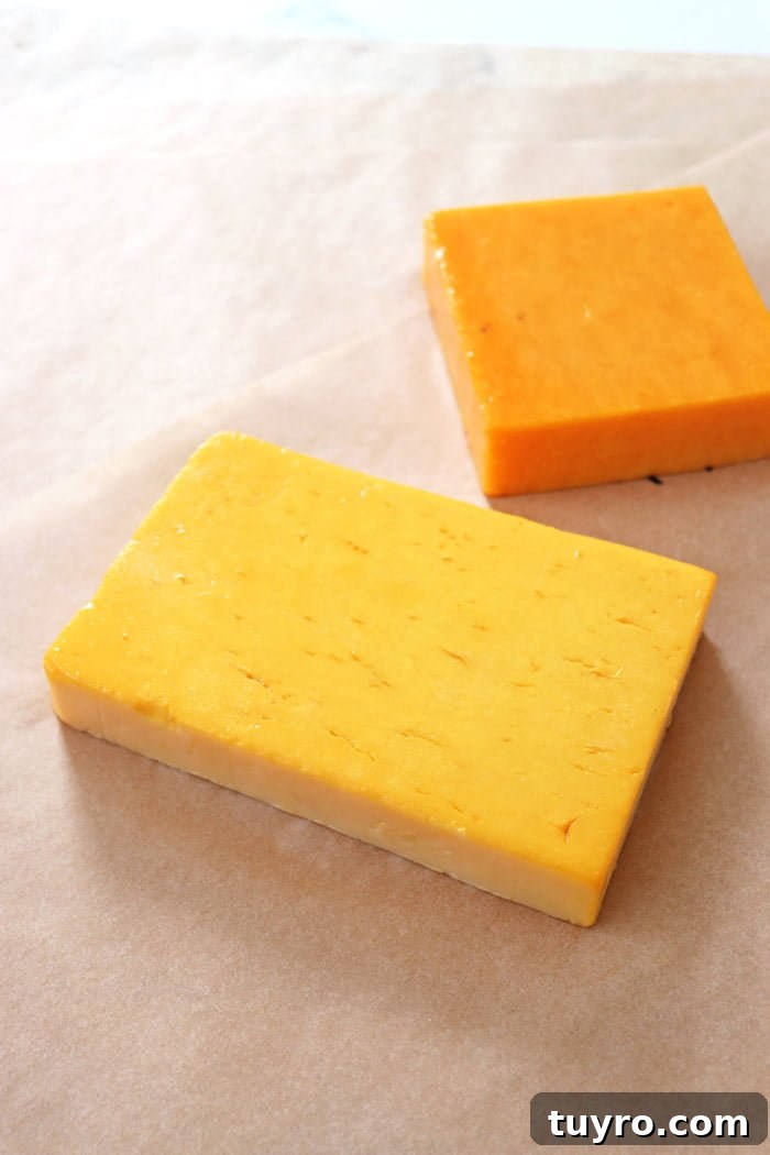 Cold Smoking Cheese: Complete Guide to Safe, Flavorful Results 6 smoked cheddar cheese resting on sheets of parchment paper