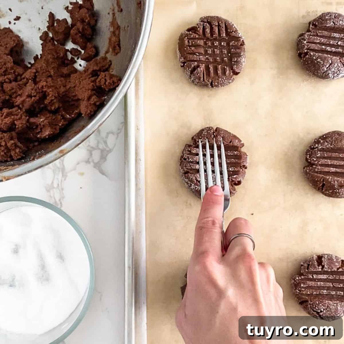 Chewy Chocolate Peanut Butter Cookies Recipe 7 cookie dough being smashed by a fork