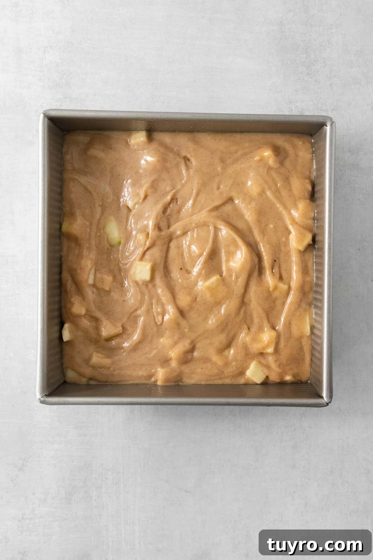 Homemade Apple Cream Cheese Coffee Cake Recipe 4 a pan filled with a mixture of peanut butter.