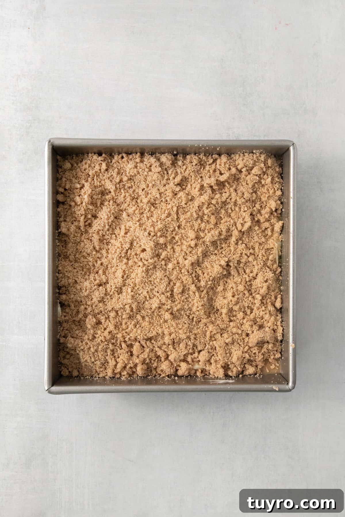 Homemade Apple Cream Cheese Coffee Cake Recipe 6 a pan filled with food on top of a table.
