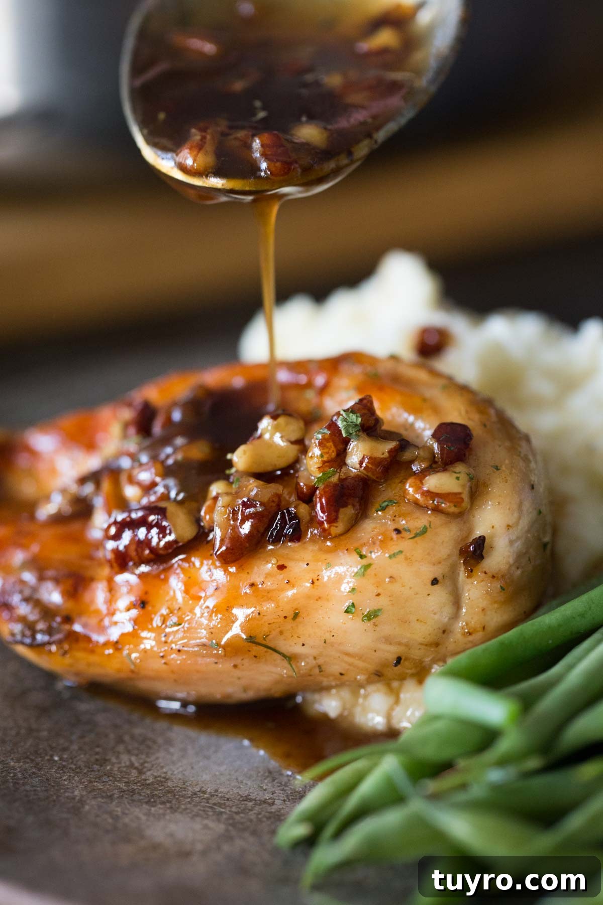 Butter Pecan Chicken Recipe with Crispy Pan-Seared Chicken and Maple Glaze 2 Sweet glaze spooned over Butter Pecan Chicken.