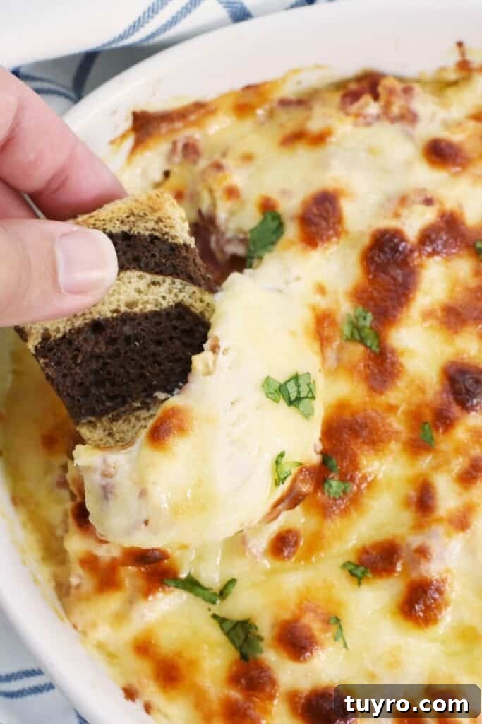 St Patricks Day Appetizers for a Festive Party 20 Scooping out some hot reuben dip.