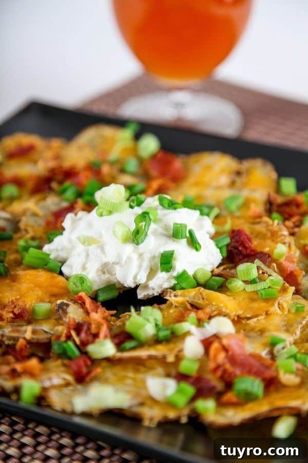 St Patricks Day Appetizers for a Festive Party 8 Irish nachos with sour cream on baking sheet.