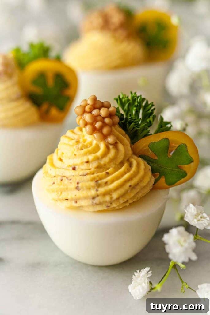 St Patricks Day Appetizers for a Festive Party 10 Deviled egg garnished with tomato.