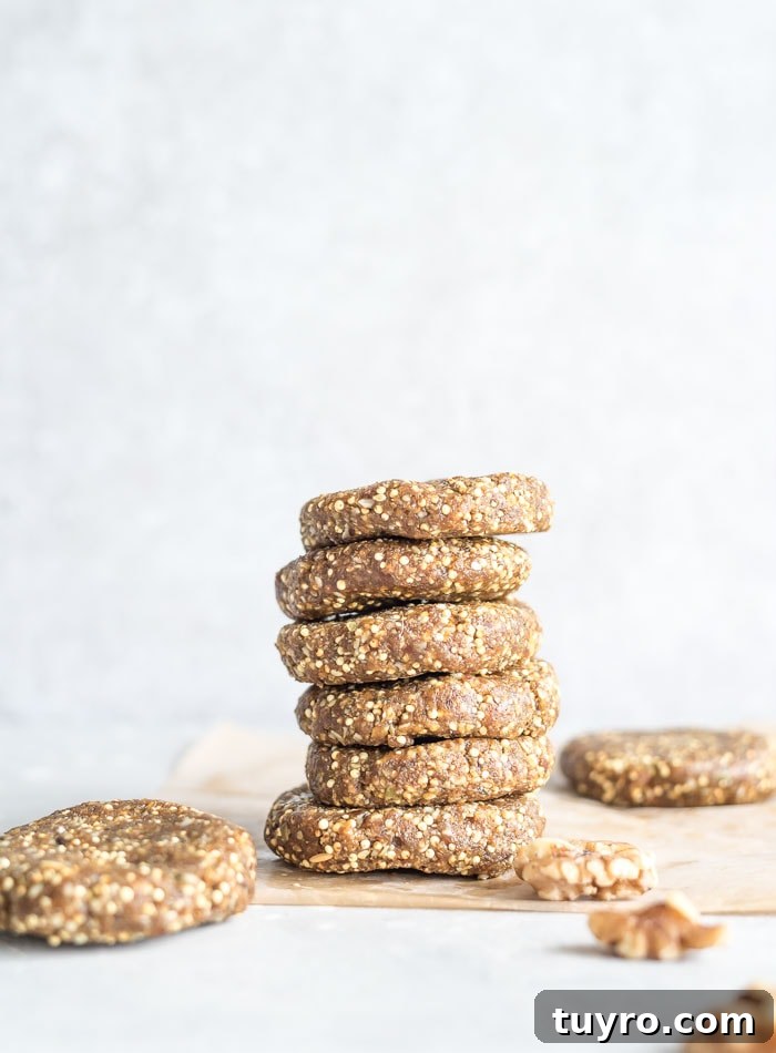 No-Bake Millet Energy Cookies: Quick No-Oven Snack Recipe 2 Stack of 5 no-bake cookies made with dates, nuts and seeds.
