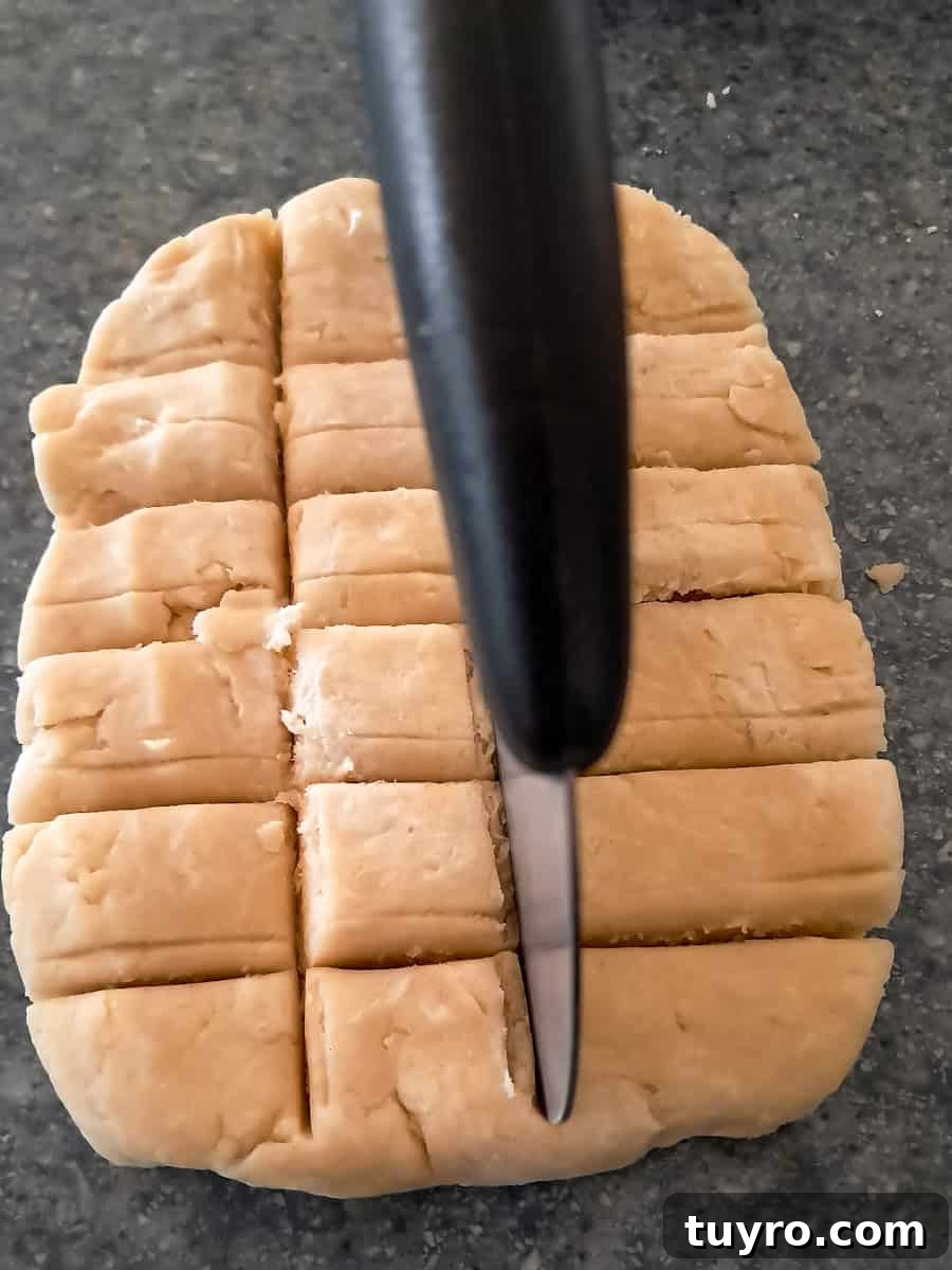 cutting dough into pieces to divide.