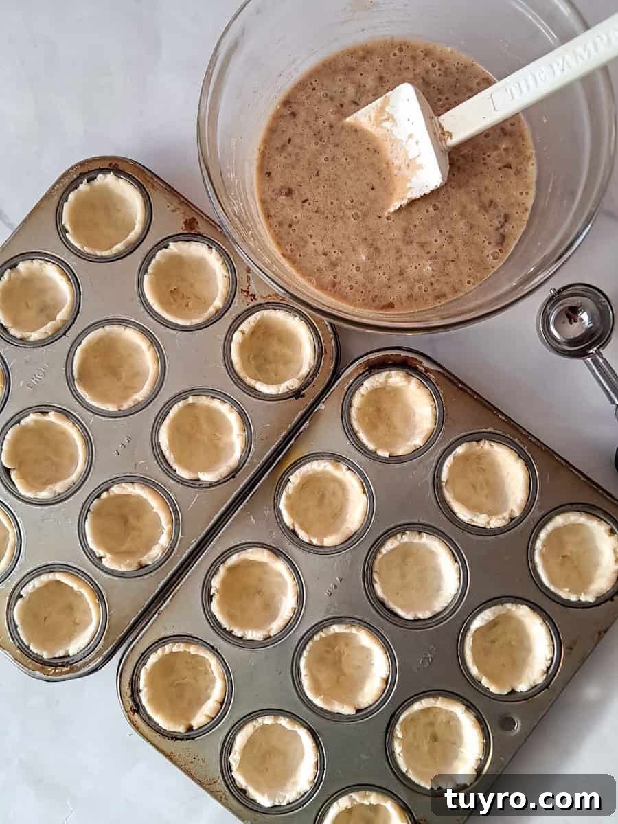 crusts pressed into mini muffin pans.