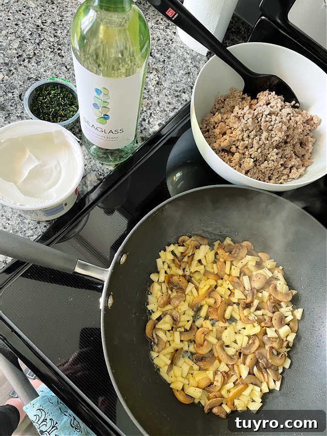 Creamy Ground Pork Stroganoff Recipe for Quick Weeknight Meals 5 showing the pork stroganoff cooking on the stove top