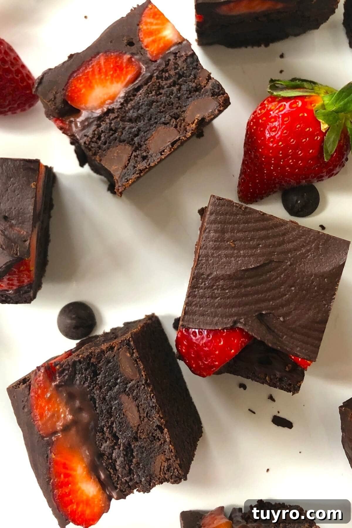 Cut small strawberry brownies on a plate.