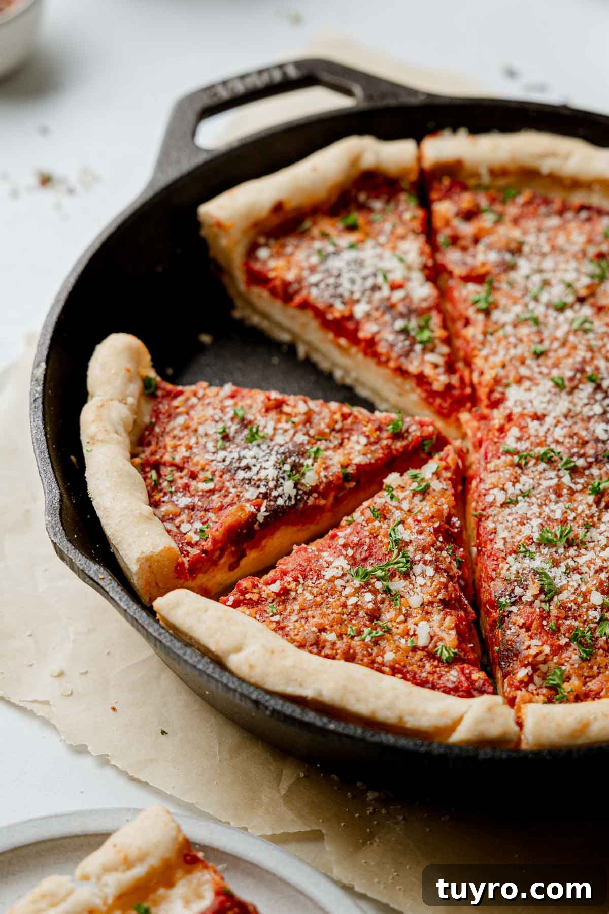 Authentic Chicago-Style Gluten-Free Deep Dish Pizza Recipe 4 Gluten free deep dish pizza in a cast iron pan, sliced.