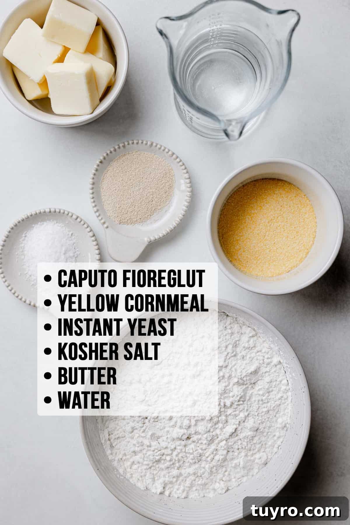 Authentic Chicago-Style Gluten-Free Deep Dish Pizza Recipe 5 Caputo fioreglut, cornmeal, yeast, butter, salt, and water measured out into bowls on white surface.