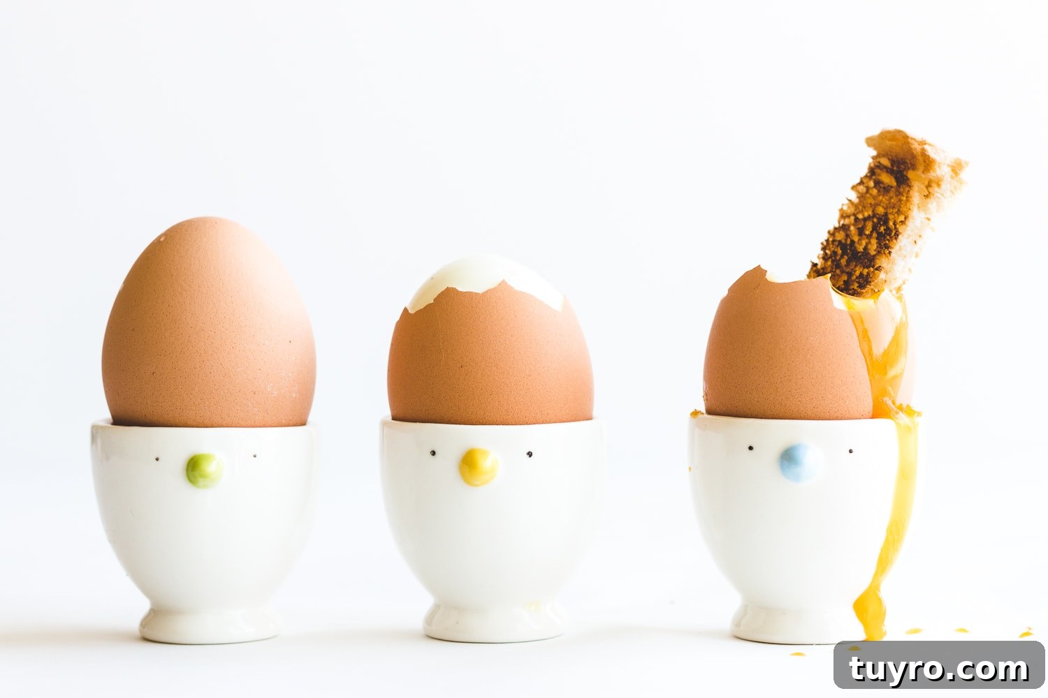How to Make Creamy Soft-Boiled Eggs Every Time 3 Three soft boiled eggs in egg cups.