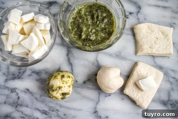 Pull-Apart Pesto Pizza Bread Recipe 4 Balling the dough around mozzarella