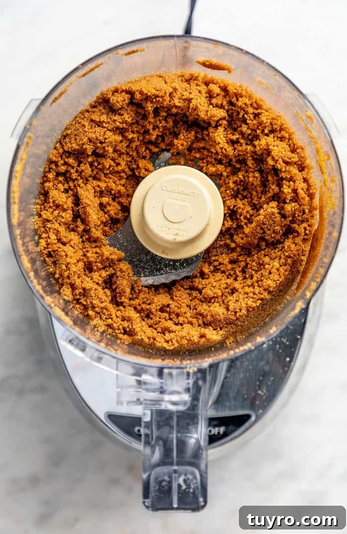 Mini No-Bake Cranberry Cheesecakes with Gingersnap Crust 6 Gingersnap cookie crumbs in the bowl of a food processor