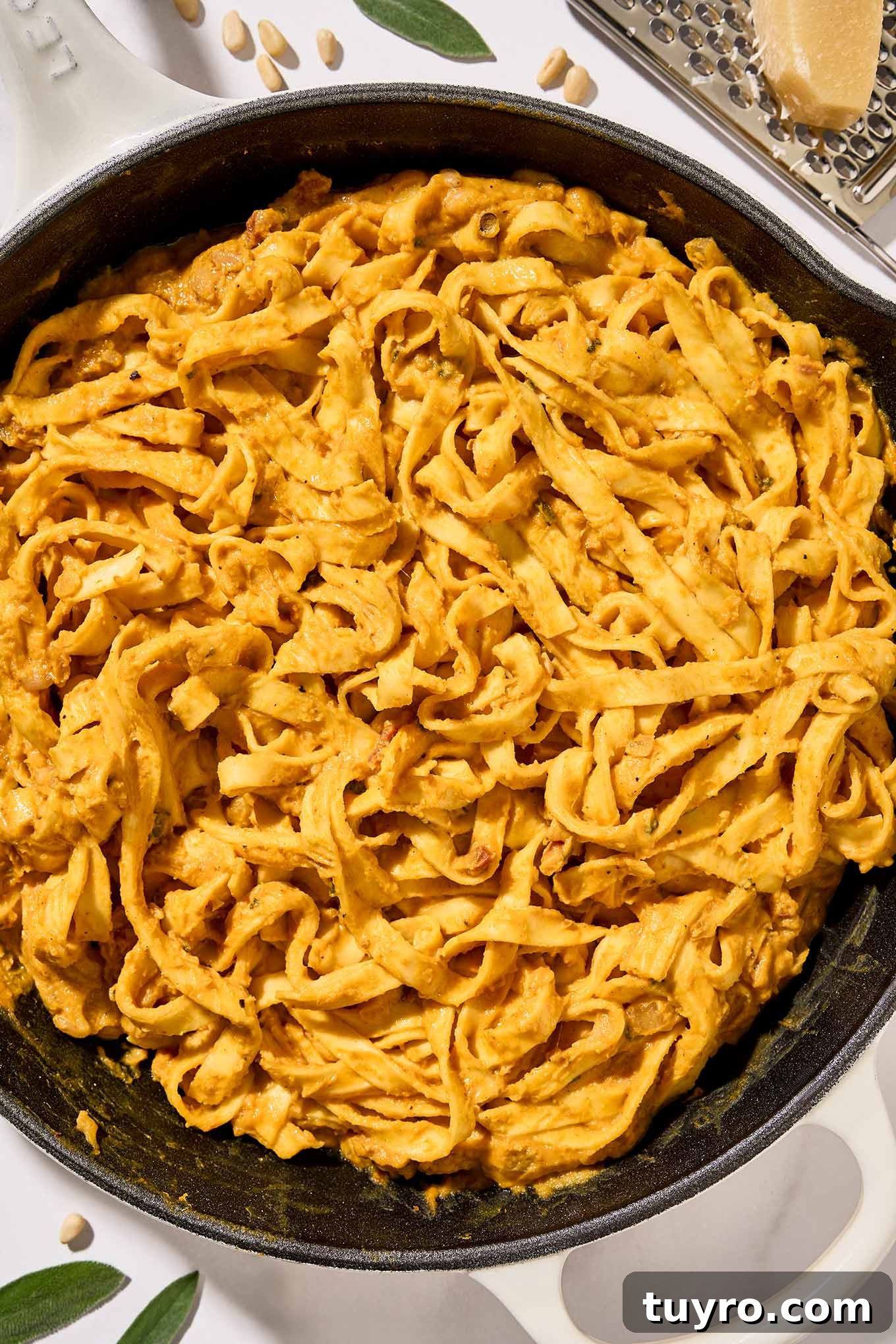 Creamy Pumpkin Pasta with Crispy Pancetta and Parmesan 7 The last step for preparing creamy pumpkin pasta, fettuccine combined with pumpkin puree, pancetta, pine nuts, sage, and half and half.