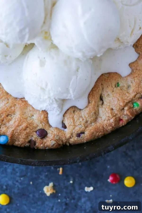 Chewy Peanut Butter Chocolate Chip Cookies Recipe 6 unsliced pizookie baked in skillet.