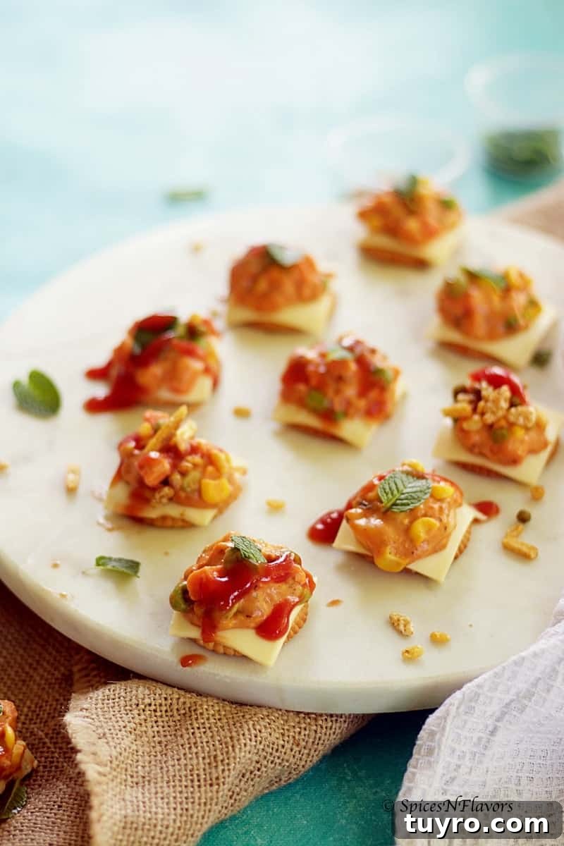 Cheesy Monaco Biscuit Bites: Party Topping Recipe 3 cheesy monaco bites monaco biscuit party topping starter recipe easy party starter recipe indian festival recipe party food potluck idea simple bachelor food