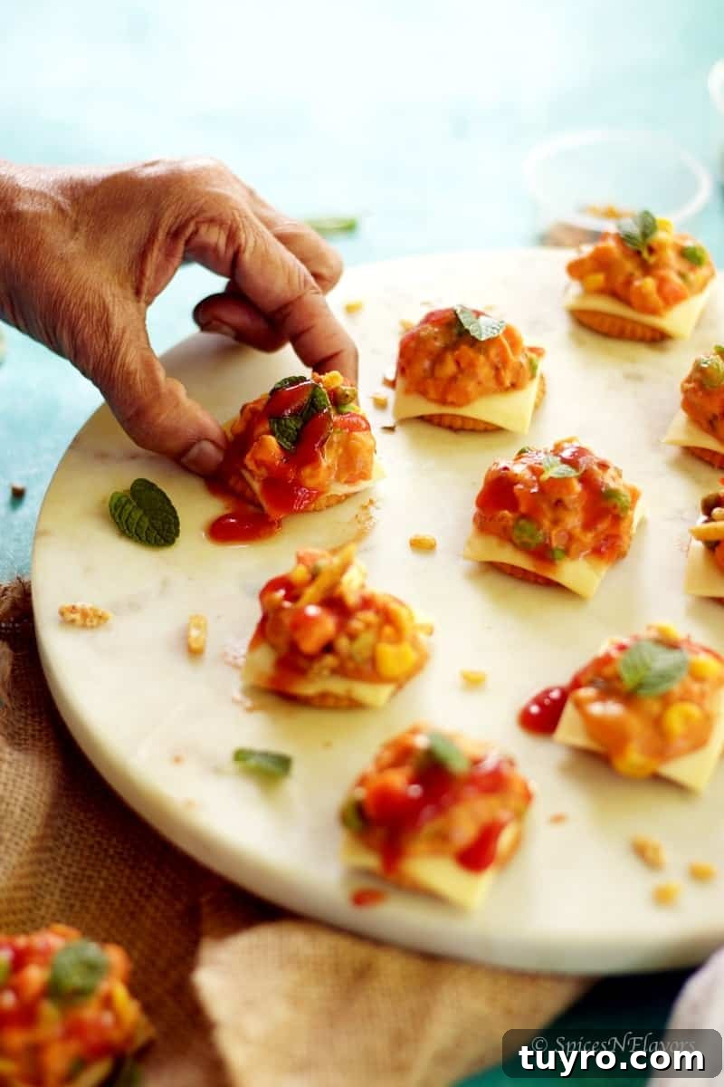 Cheesy Monaco Biscuit Bites: Party Topping Recipe 4 cheesy monaco bites monaco biscuit party topping starter recipe easy party starter recipe indian festival recipe party food potluck idea simple bachelor food