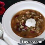 Bowl of Vegan Bean Soup with a pansy to the side