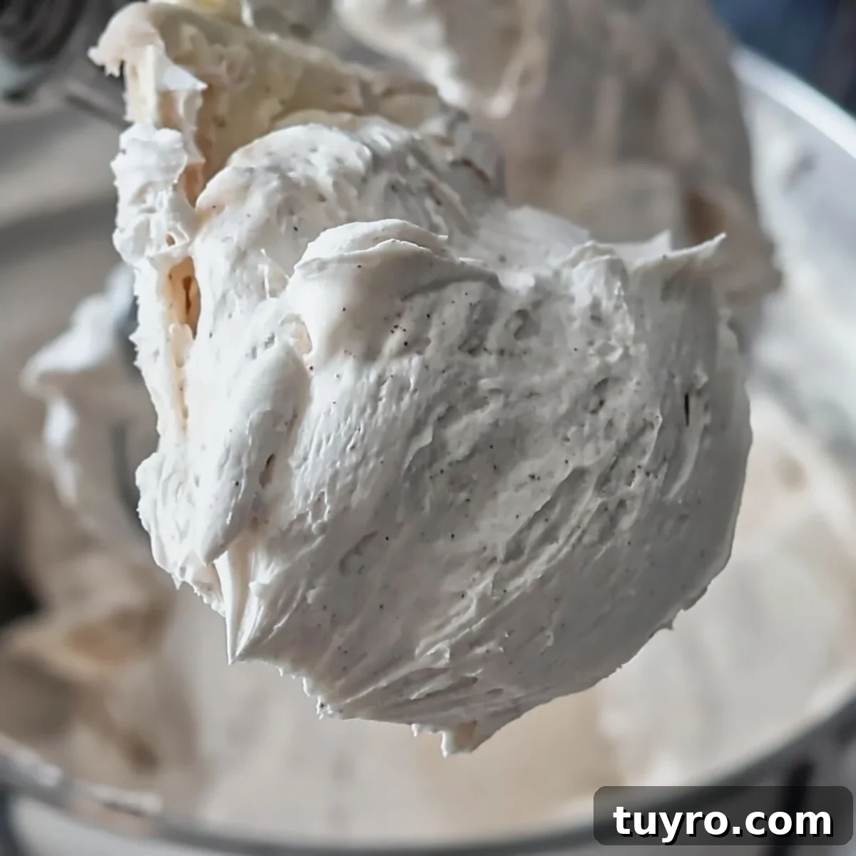 smooth cinnamon buttercream on silicone spatula.