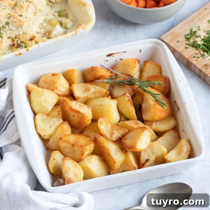 Duck fat roast potatoes in a white dish.