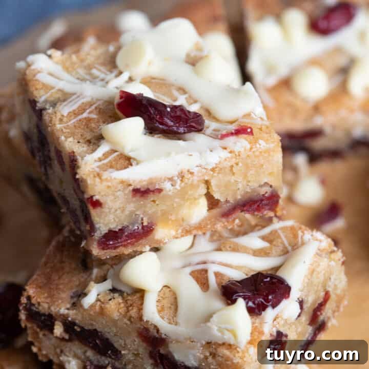 A stack of cranberry white chocolate blondies.